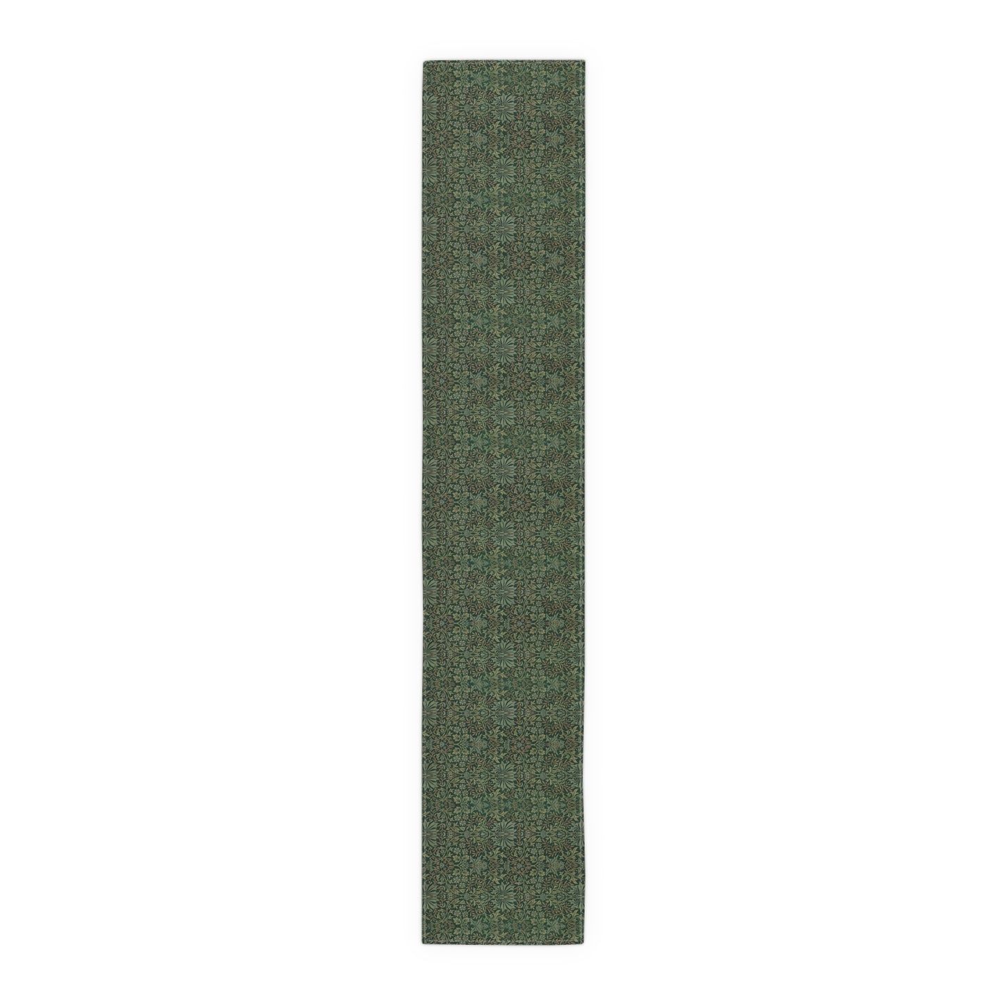 A green table runner with a floral William Morris & Co pattern displayed on a dining table.