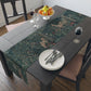 A table runner with a floral William Morris & Co pattern, featuring green leaves and pink flowers with a fox, dear and rabbit.