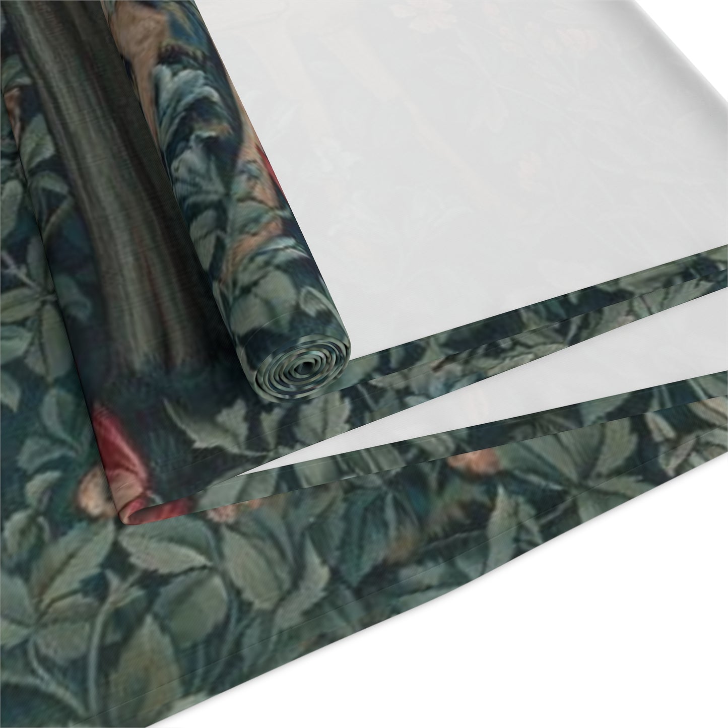 A table runner with a floral William Morris & Co pattern, featuring green leaves and pink flowers with a fox, dear and rabbit.