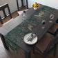 A table runner with a floral William Morris & Co pattern, featuring green leaves and pink flowers with a fox, dear and rabbit.