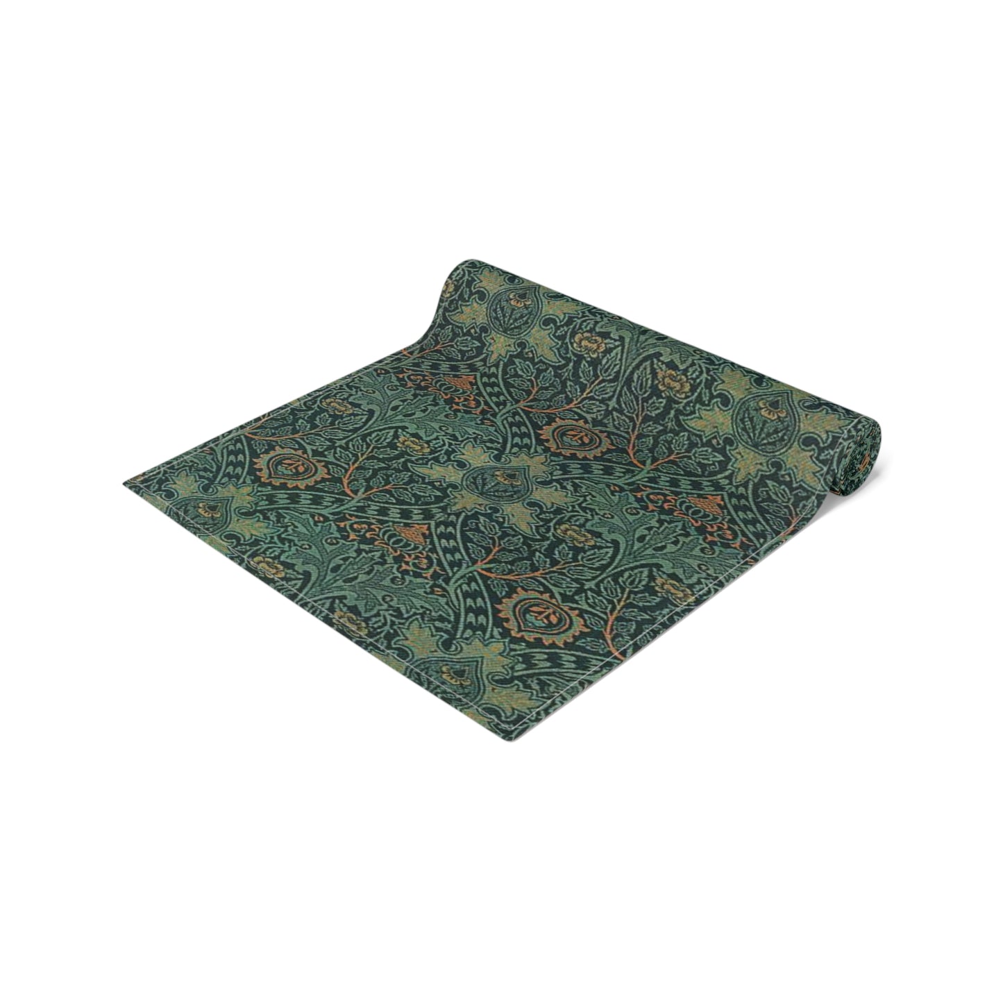 A green table runner with a floral pattern inspired by William Morris, displayed on a dining table with dishes and cutlery.