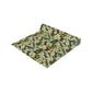 A green floral patterned table runner by William Morris & Co, Leicester Collection, displayed on a dining table.
