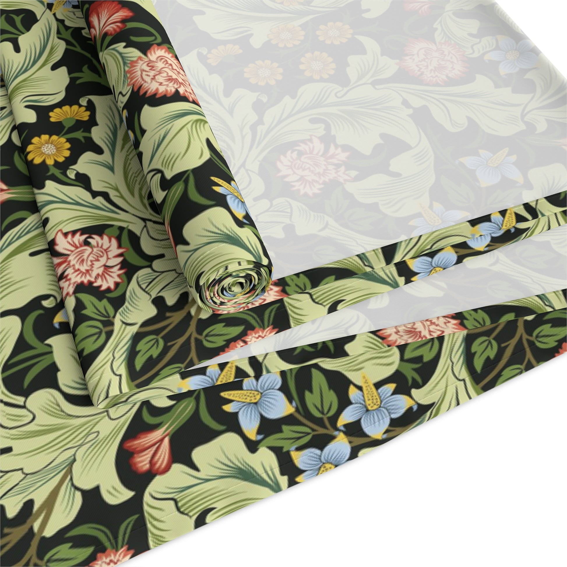 A green floral patterned table runner by William Morris & Co, Leicester Collection, displayed on a dining table.