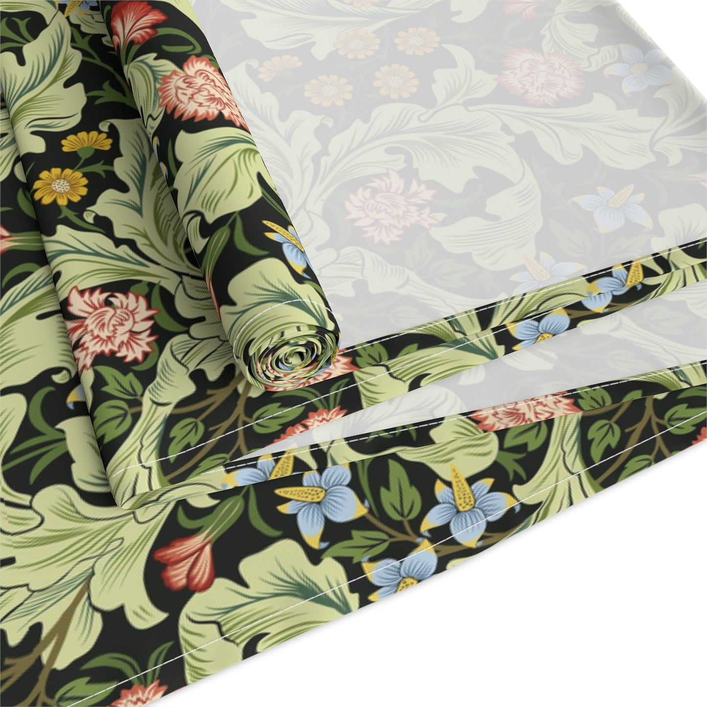 A green floral patterned table runner by William Morris & Co, Leicester Collection, displayed on a dining table.