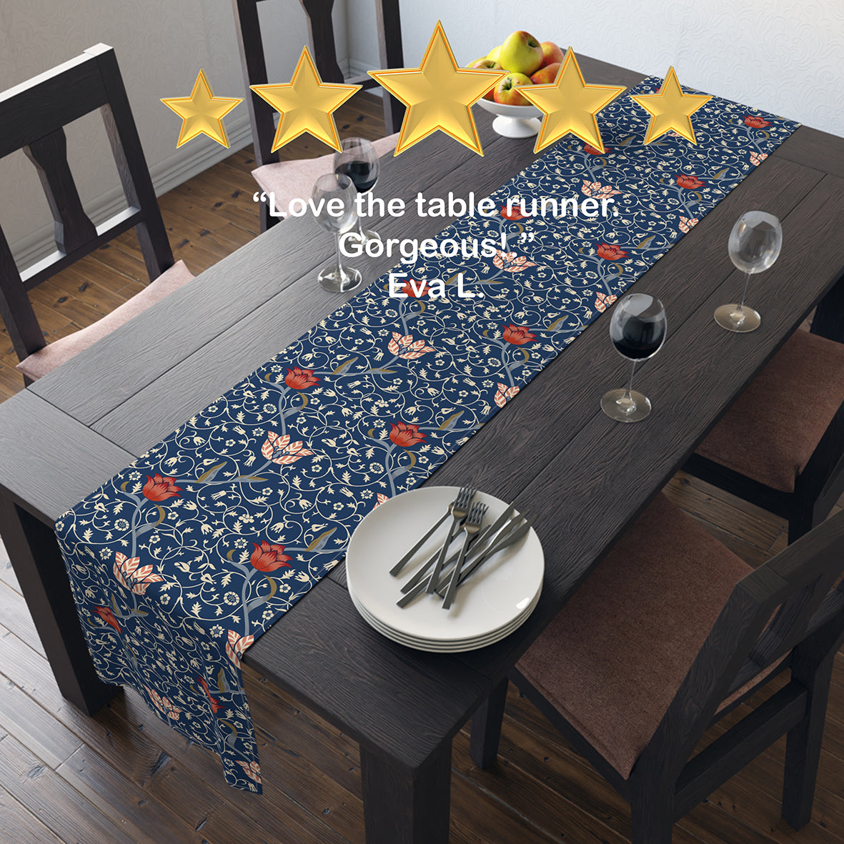 A table runner with a floral pattern in shades of red and blue, displayed on a dining table.