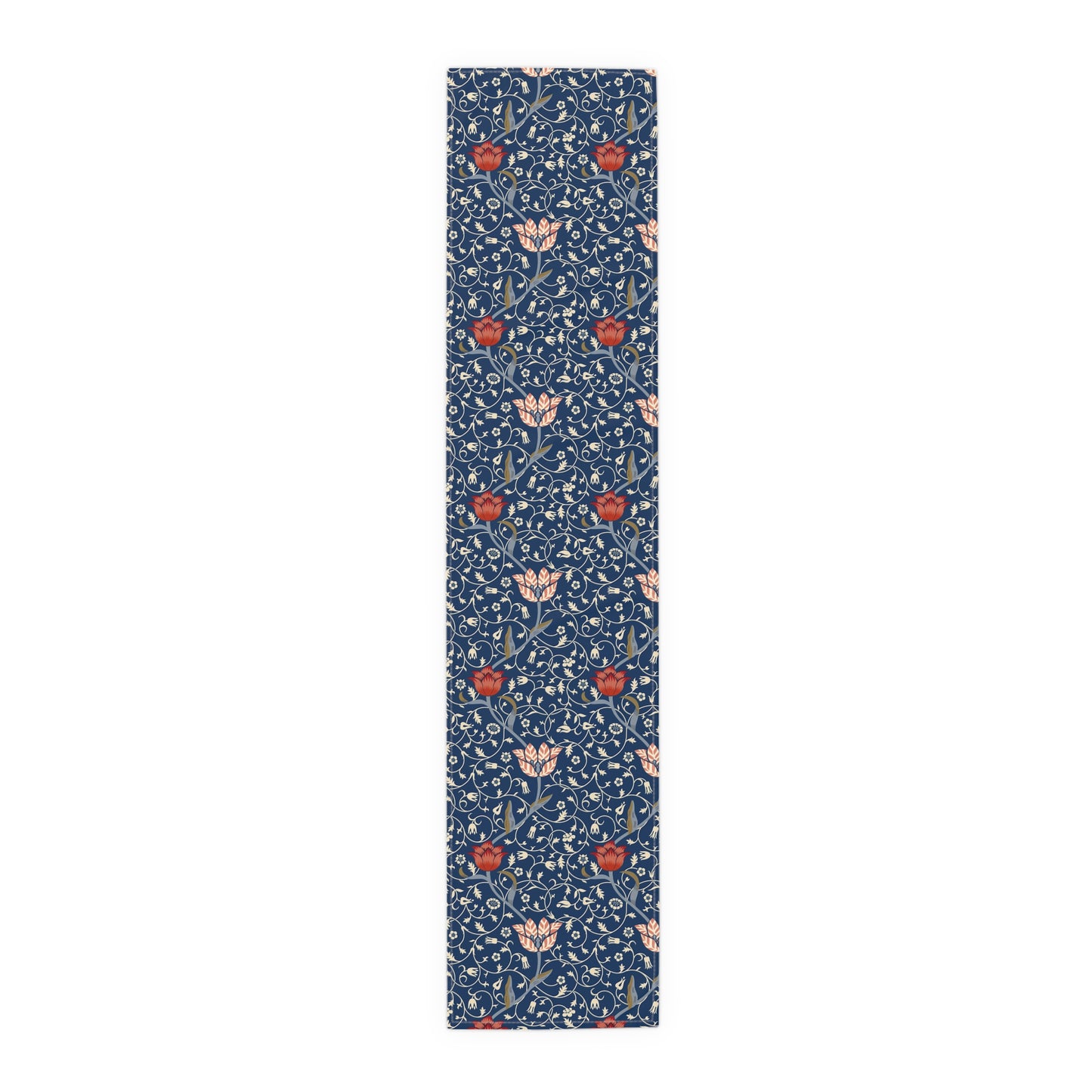A William Morris & Co table runner with a floral pattern  called Medway in shades of red and blue, displayed on a dining table.