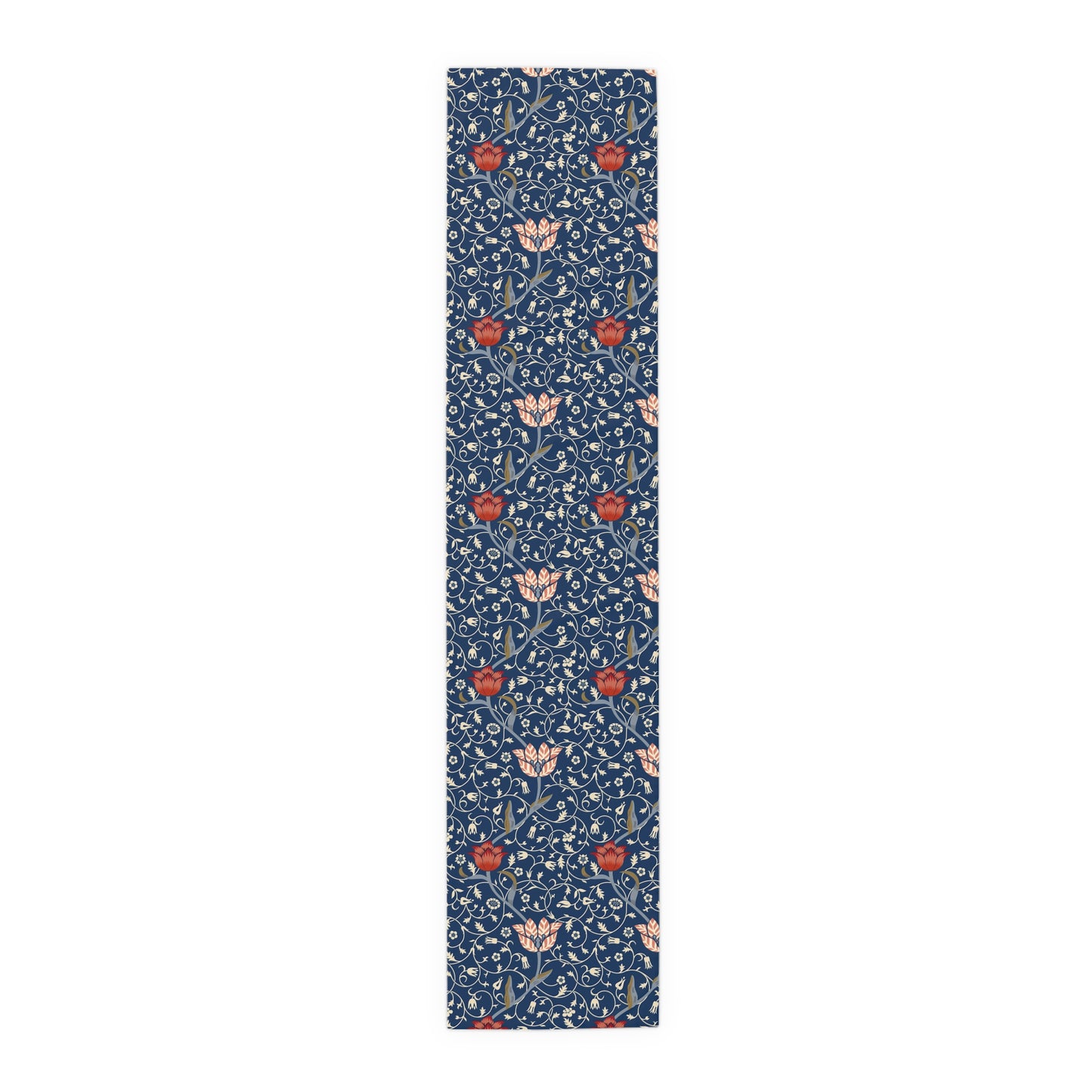 A William Morris & Co table runner with a floral pattern  called Medway in shades of red and blue, displayed on a dining table.