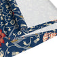 A William Morris & Co table runner with a floral pattern  called Medway in shades of red and blue, displayed on a dining table.