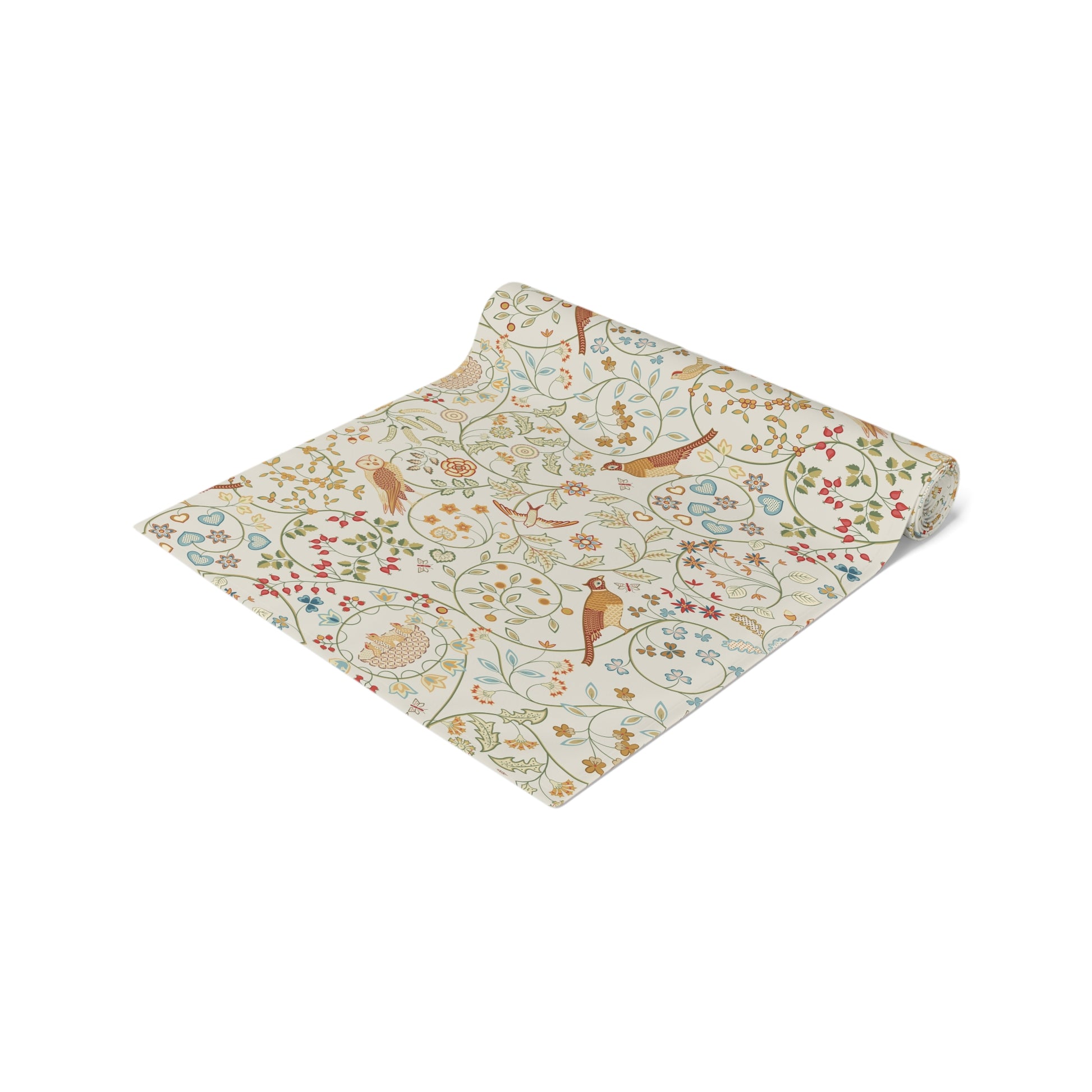 Floral and bird patterned fabric on a white background