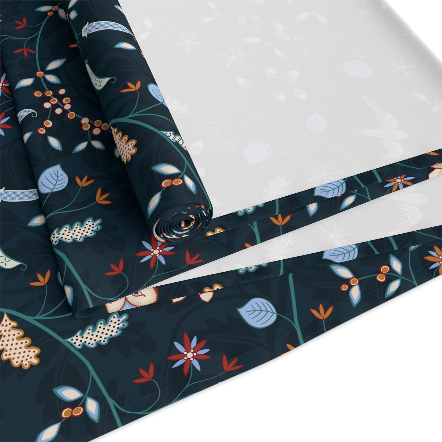 Roll of fabric with a floral pattern on a white background