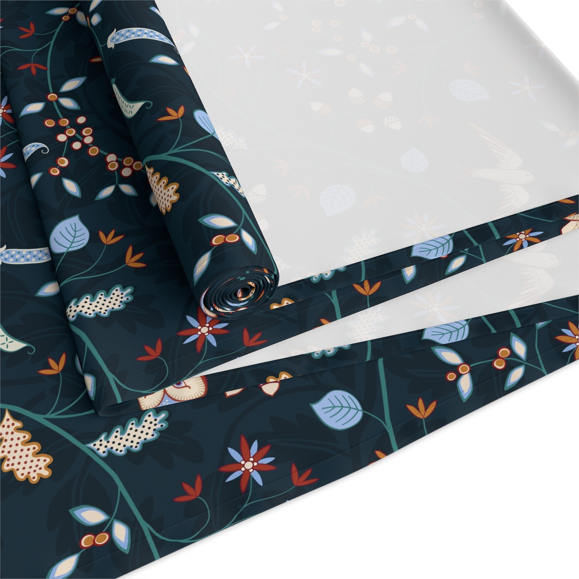 Roll of fabric with a floral pattern on a white background