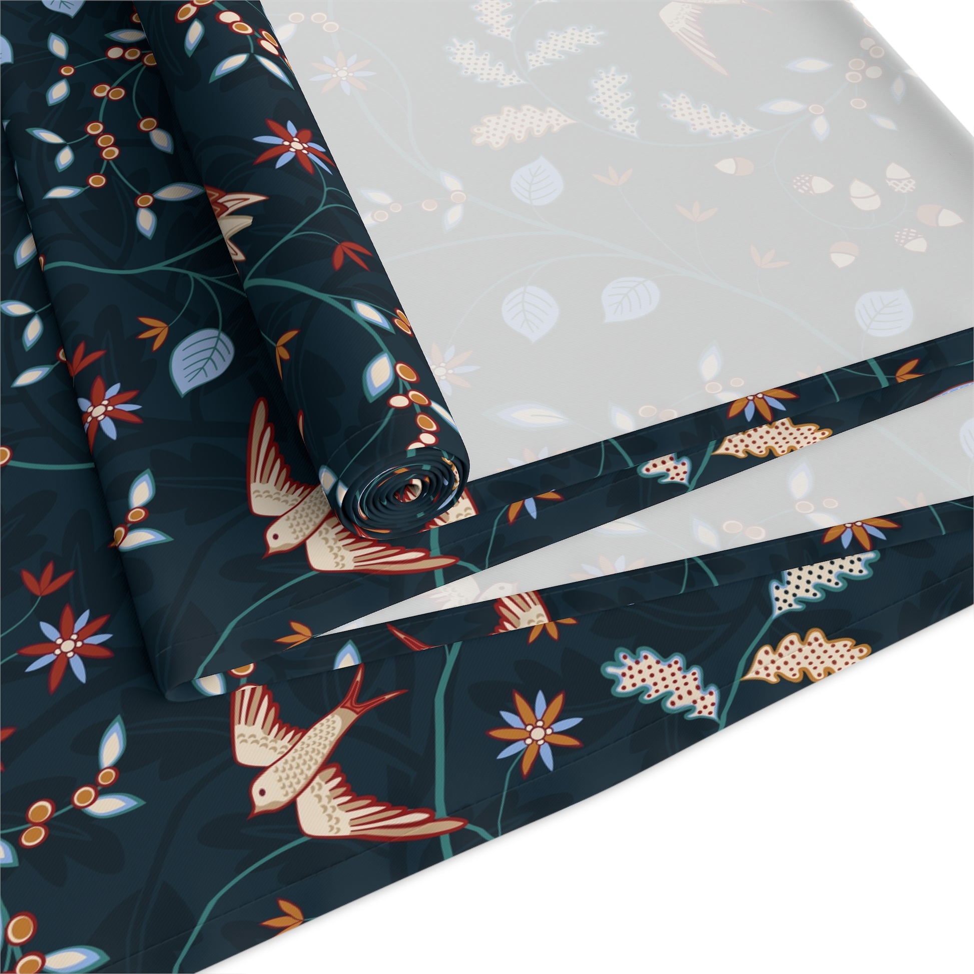 Roll of decorative paper with bird and floral pattern on a white background