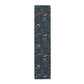 Table runner with a floral and animal pattern on a white background