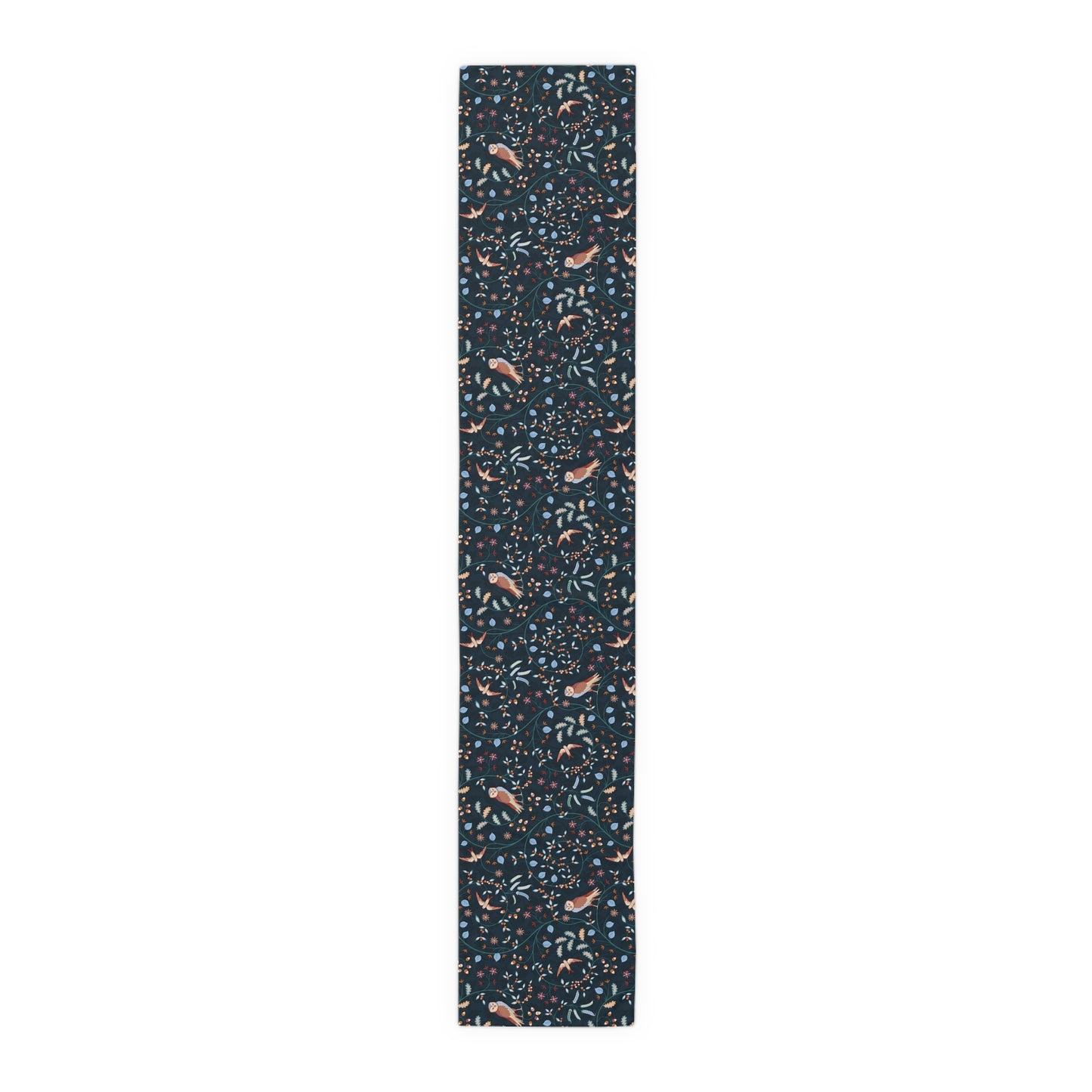 Table runner with a pattern of small, colourful designs on a dark blue background