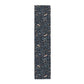 Table runner with nature-themed design on a white background
