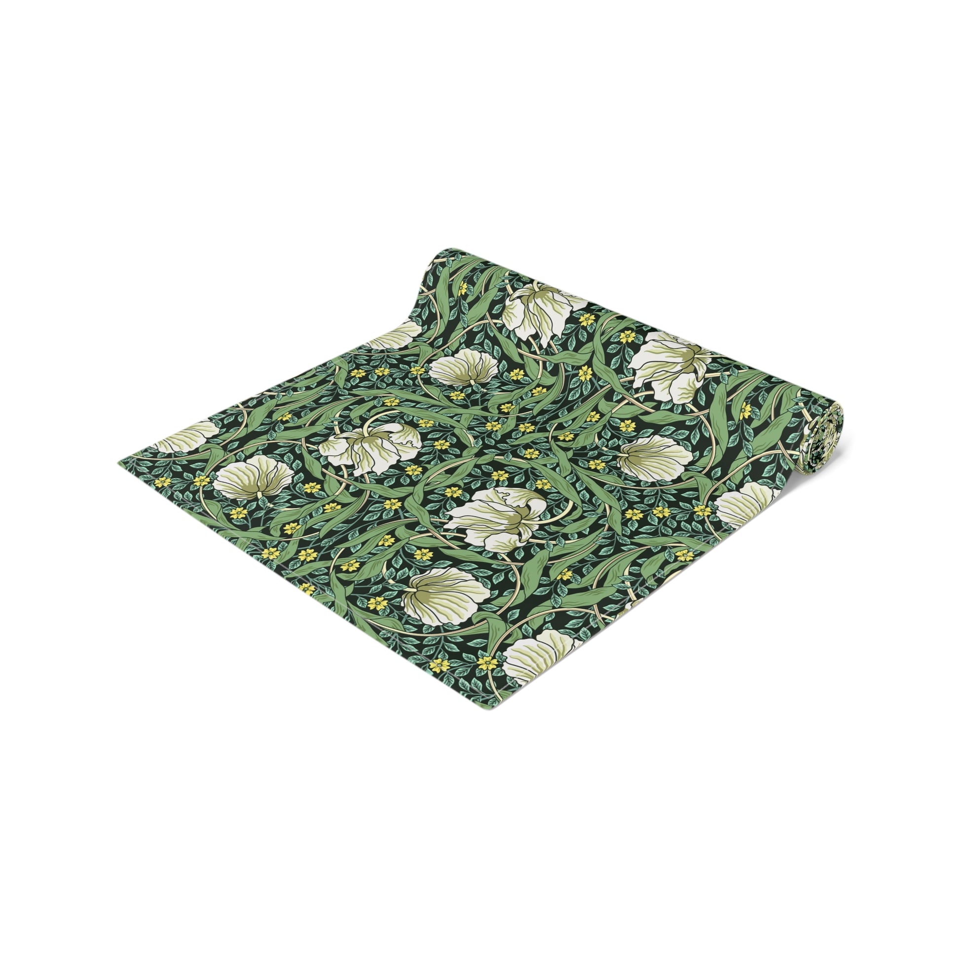 A green table runner with a floral William Morris & Co pattern displayed on a dining table.