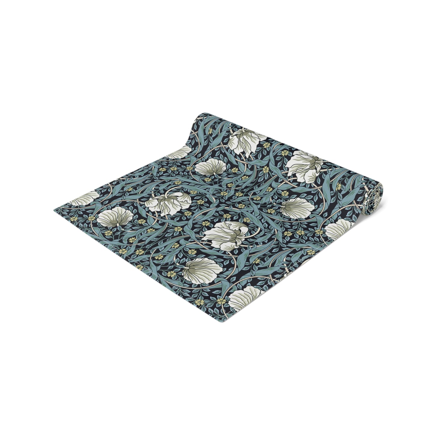 A table runner with a floral William Morris & Co pattern in slate colour laid out on a dining table.