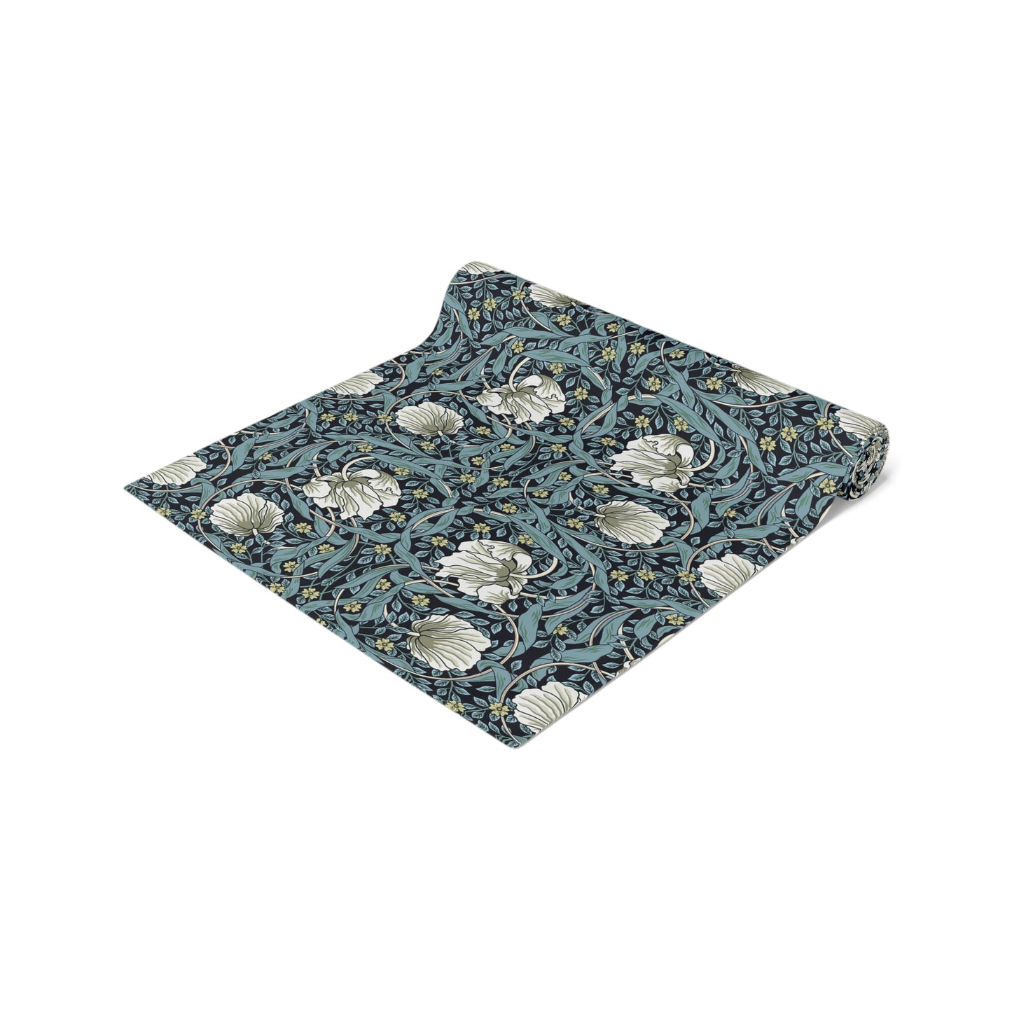 A table runner with a floral William Morris & Co pattern in slate colour laid out on a dining table.