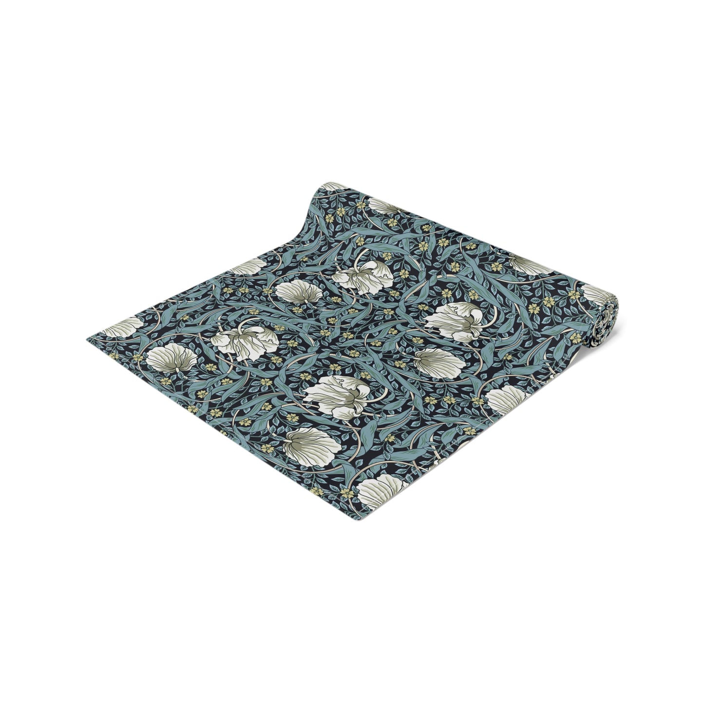 A table runner with a floral William Morris & Co pattern in slate colour laid out on a dining table.