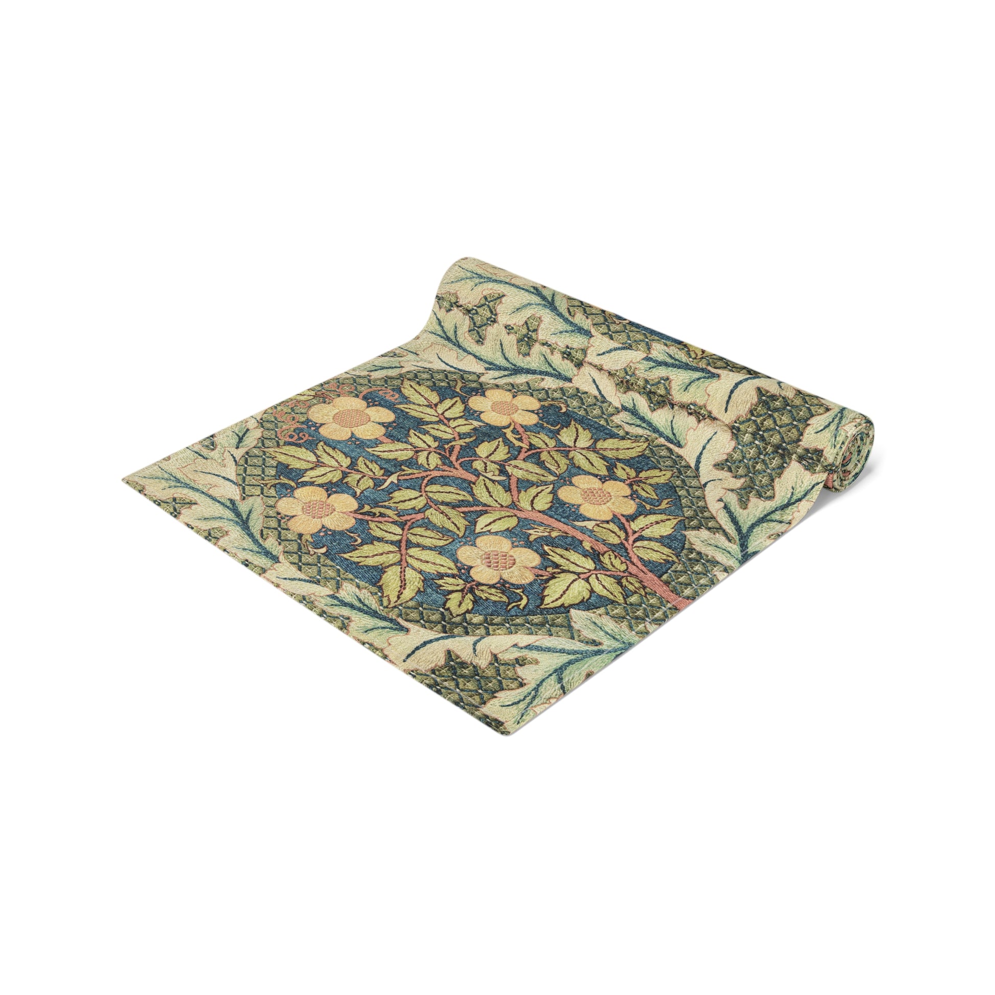 A table runner with a floral pattern inspired by William Morris, displayed on a dining table set with dishes and glasses.