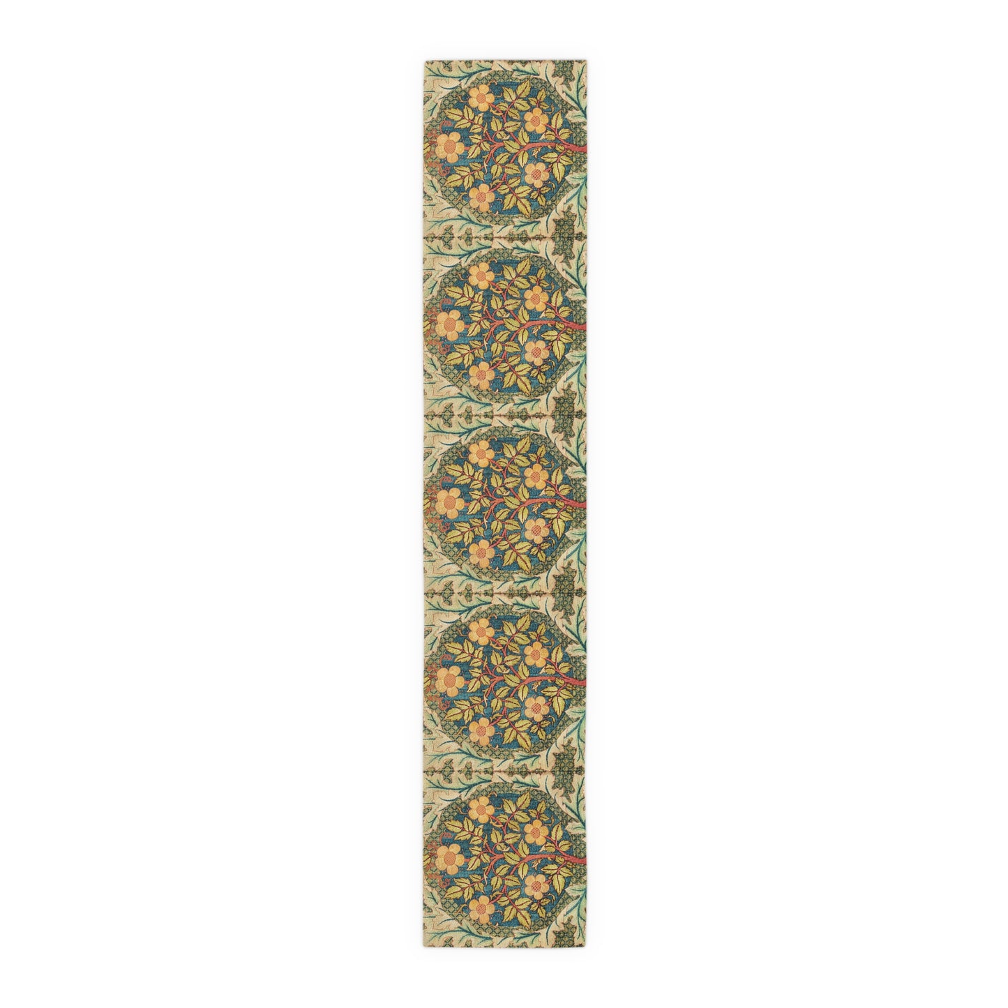 A table runner with a floral pattern inspired by William Morris, displayed on a dining table set with dishes and glasses.