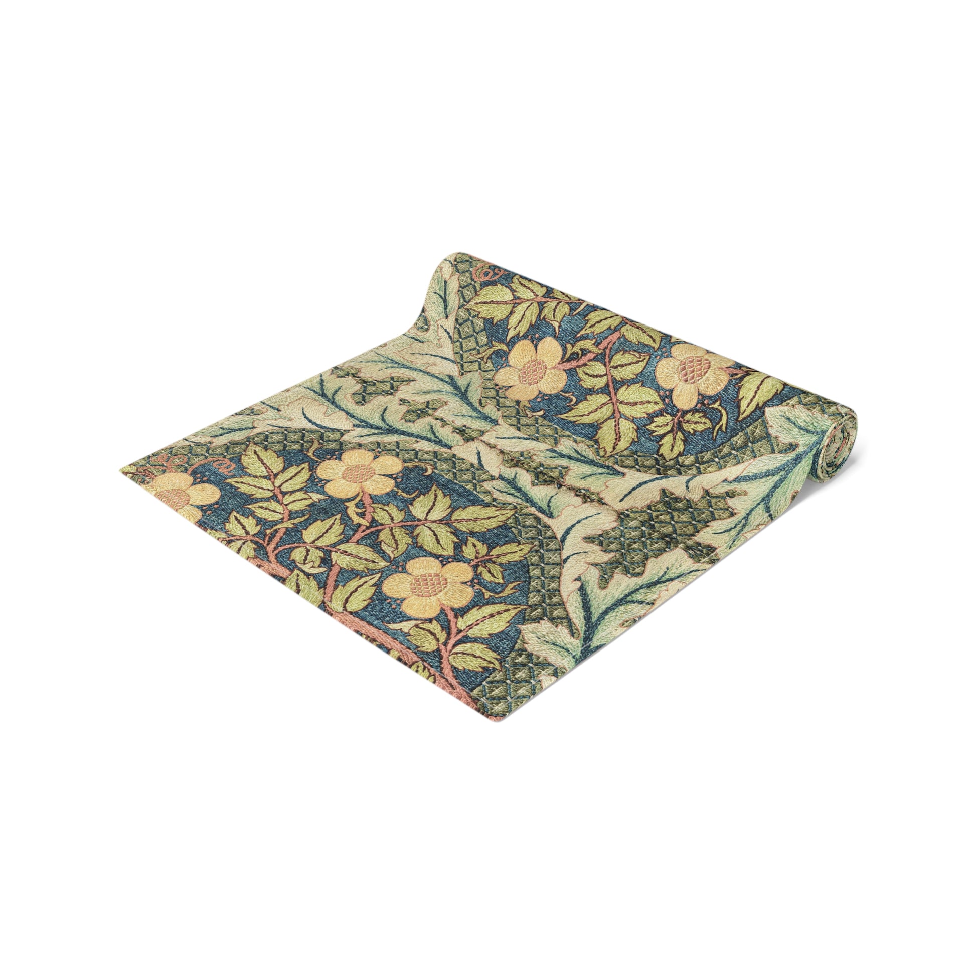 A table runner with a floral pattern inspired by William Morris, displayed on a dining table set with dishes and glasses.
