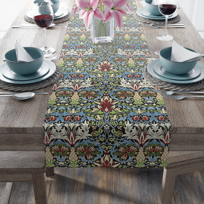 A multicolored floral table runner with geometric patterns displayed on a dining table.