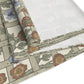 Roll of floral-patterned wallpaper with wooden lattice design on a white background