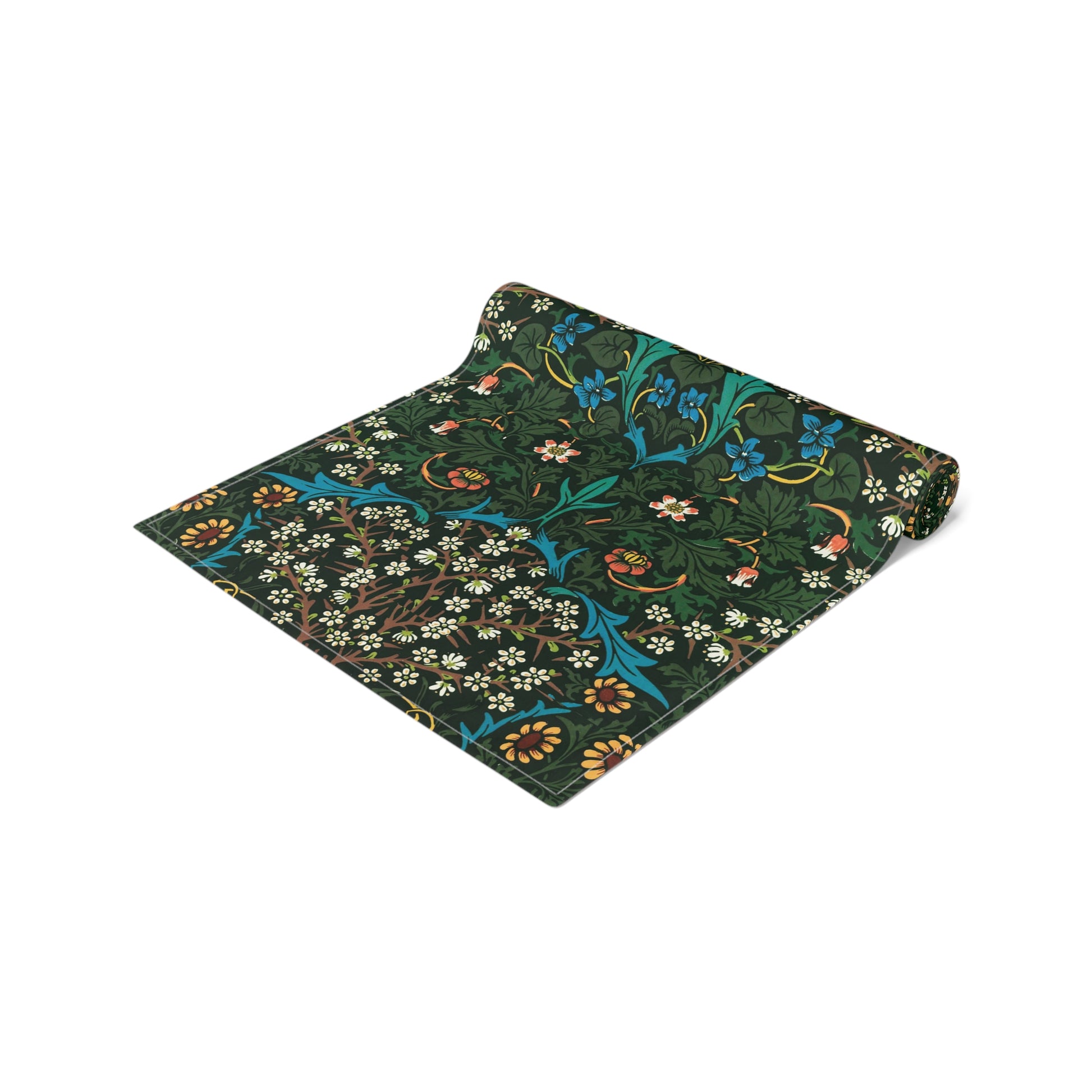 A floral patterned table runner inspired by William Morris, displayed on a dining table.