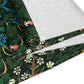A floral patterned table runner inspired by William Morris, displayed on a dining table.