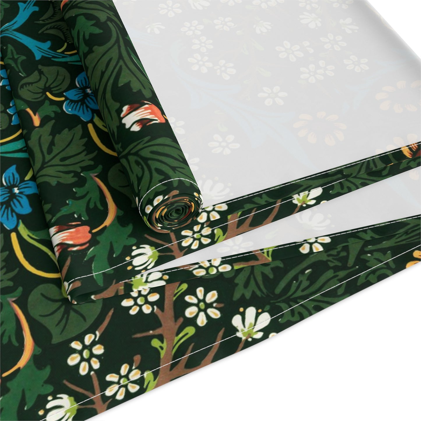 A floral patterned table runner inspired by William Morris, displayed on a dining table.