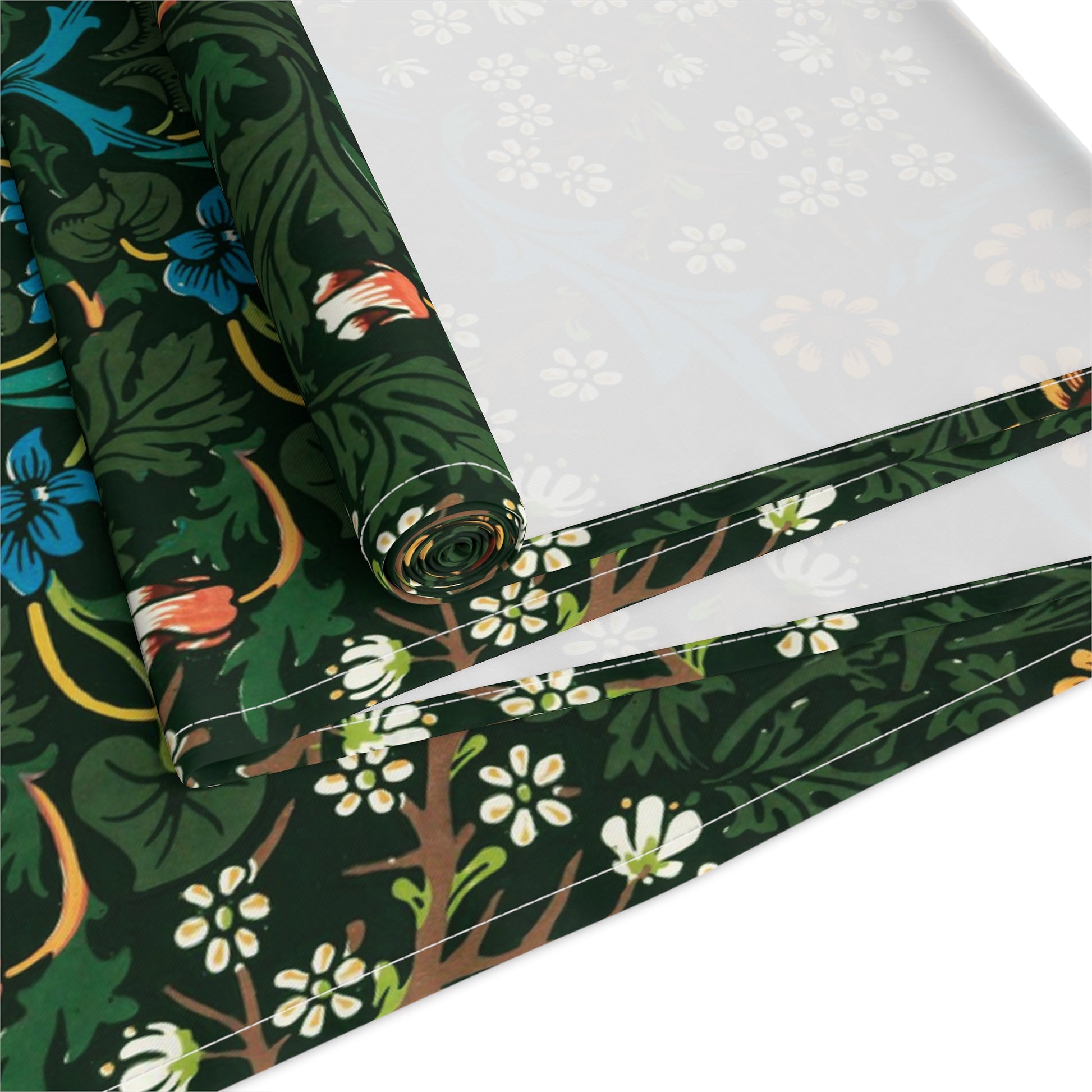 A floral patterned table runner inspired by William Morris, displayed on a dining table.