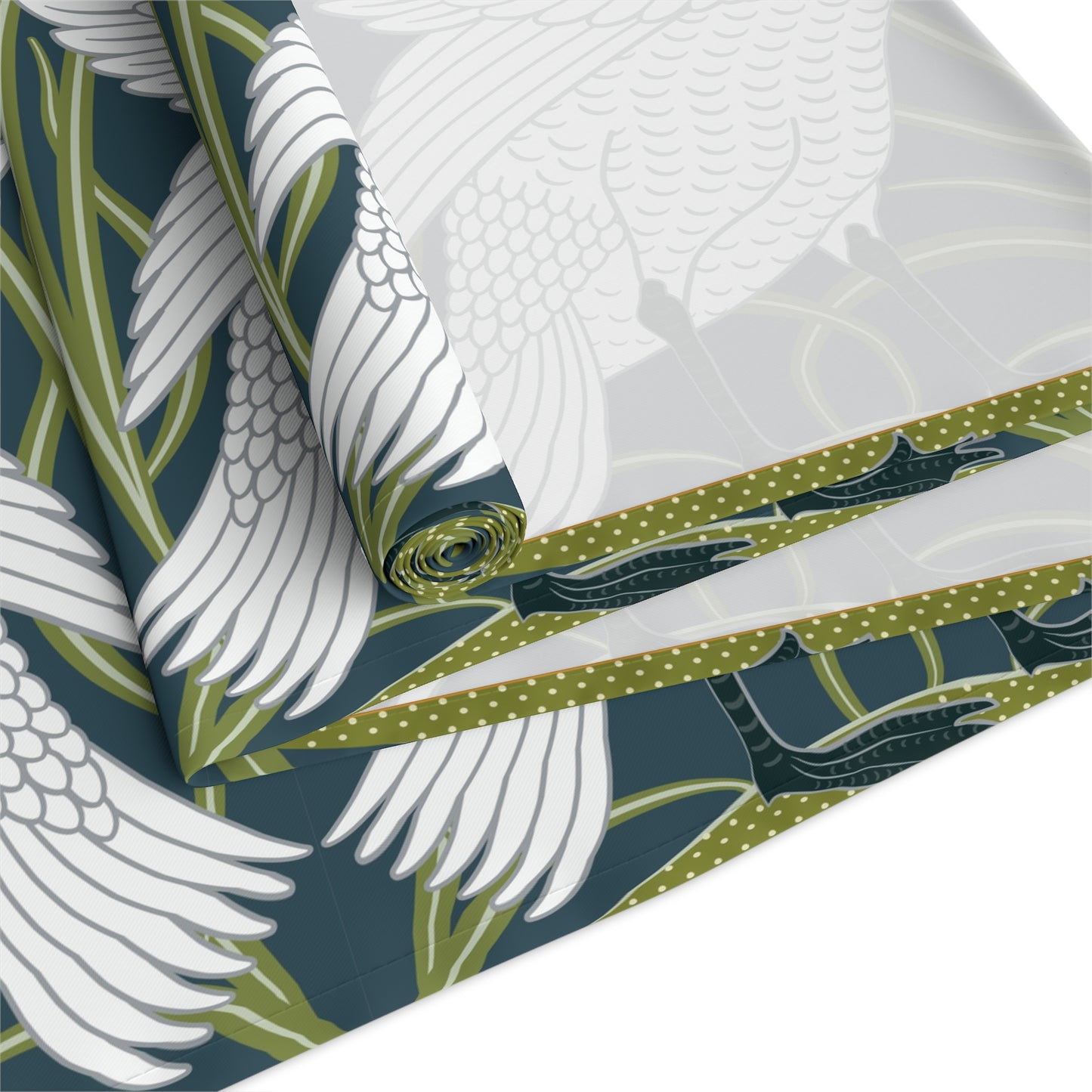 Fabric with white bird and green leaf pattern on a blue background