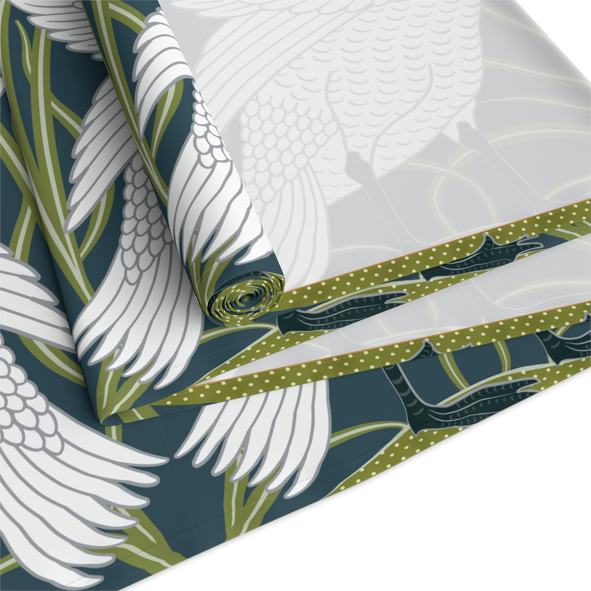 Fabric with white bird and green leaf pattern on a blue background