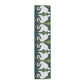 Decorative mat with white swan design on a green background