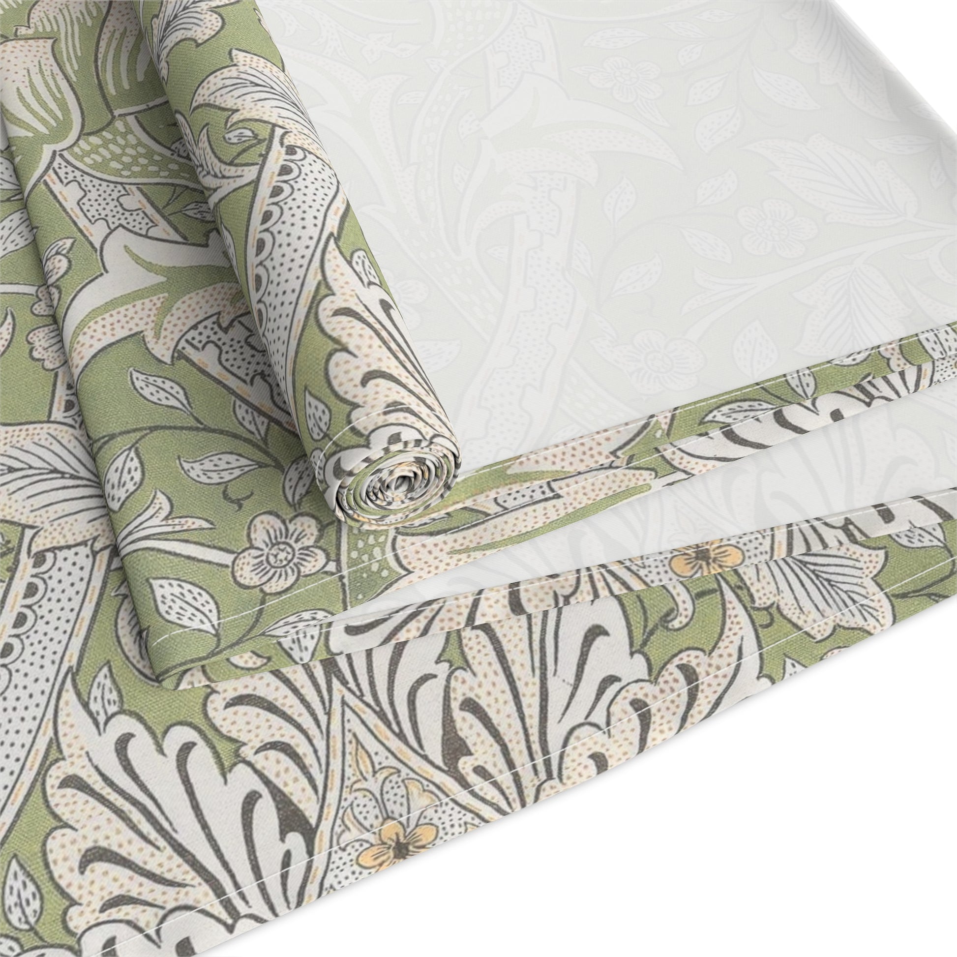 Floral patterned fabric with green, beige, and white colors on a white background