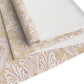 Roll of floral-patterned fabric on a white background