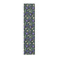 Floral patterned mat with purple flowers and green leaves on a white background