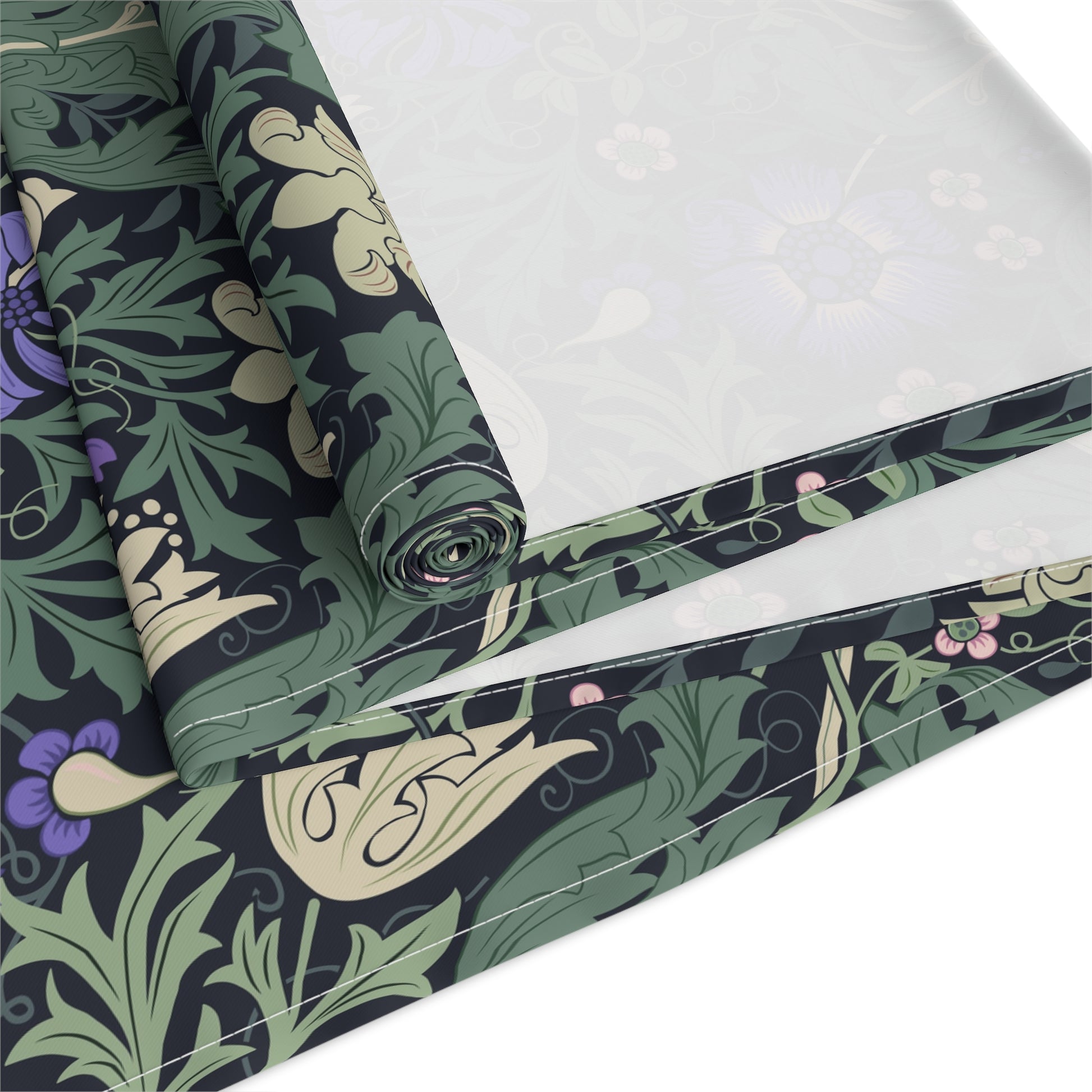 Roll of fabric with a floral pattern on a white background