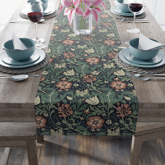 Dining table set with a floral patterned table runner, bowls, and wine glasses.