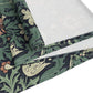 Roll of fabric with a floral pattern on a white background