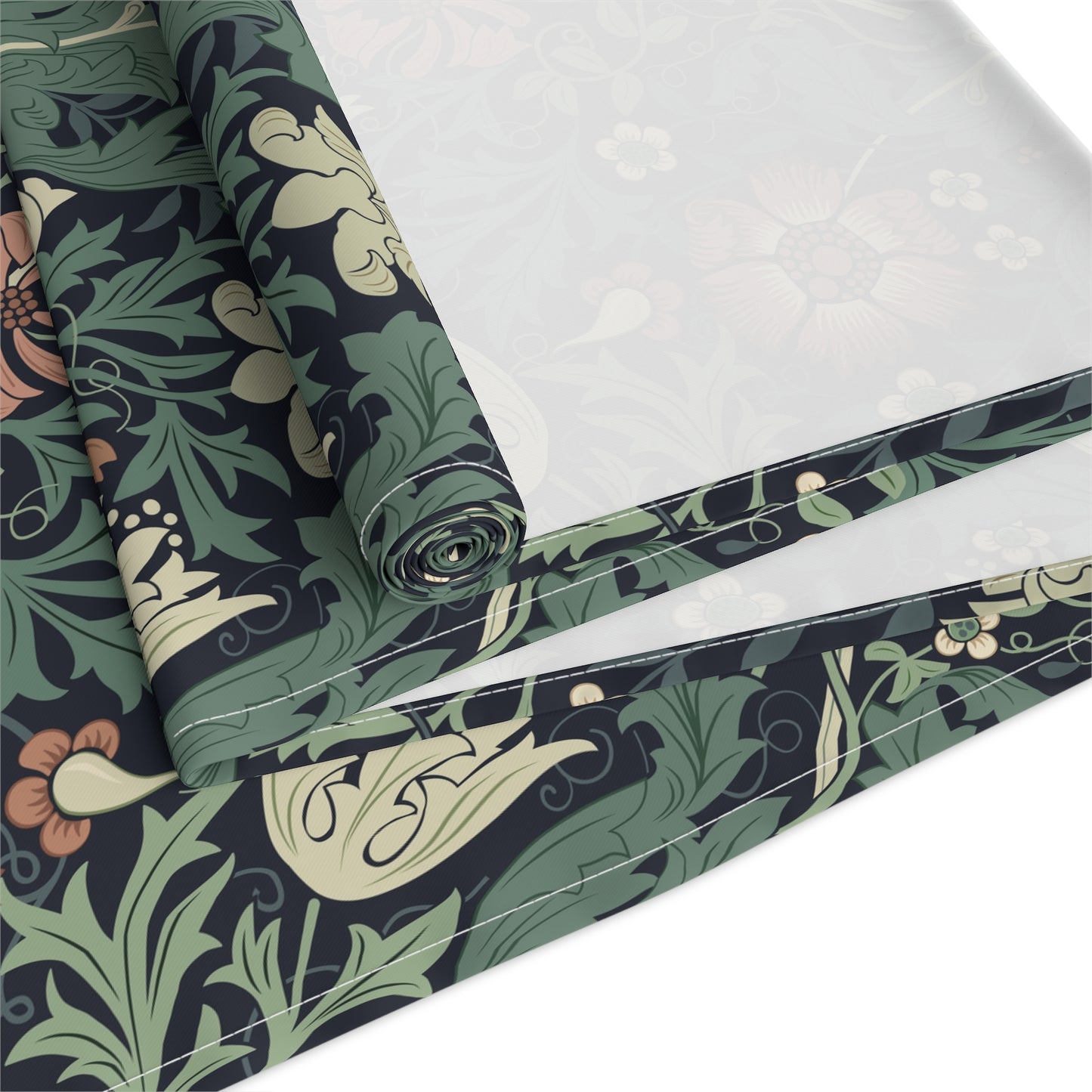Roll of fabric with a floral pattern on a white background