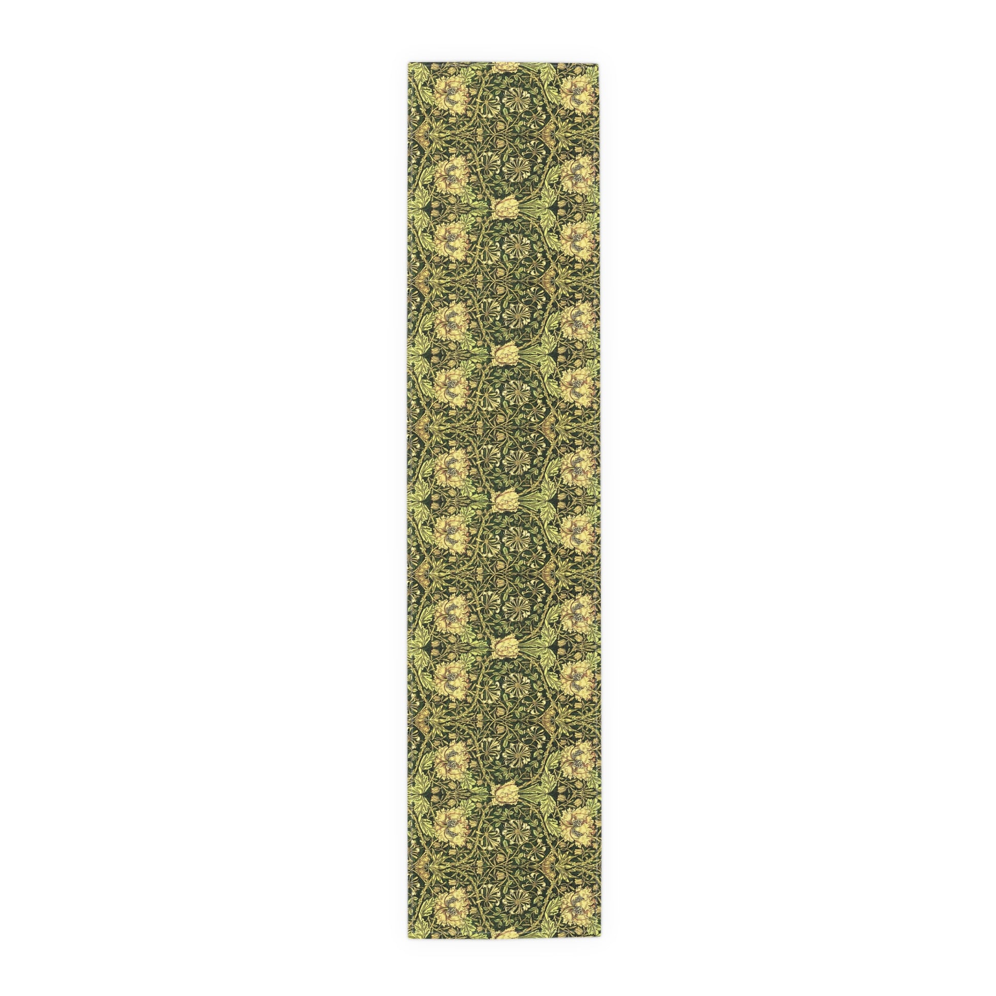 A floral patterned table runner in gold and green shades, laid out on a dining table with place settings and decorative flowers.