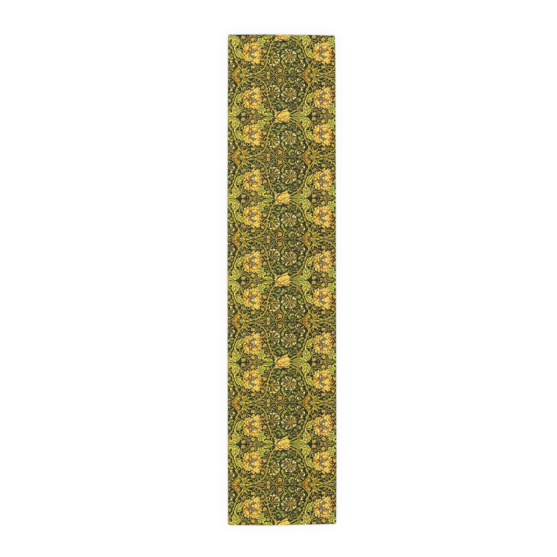A floral patterned table runner in gold and green shades, laid out on a dining table with place settings and decorative flowers.