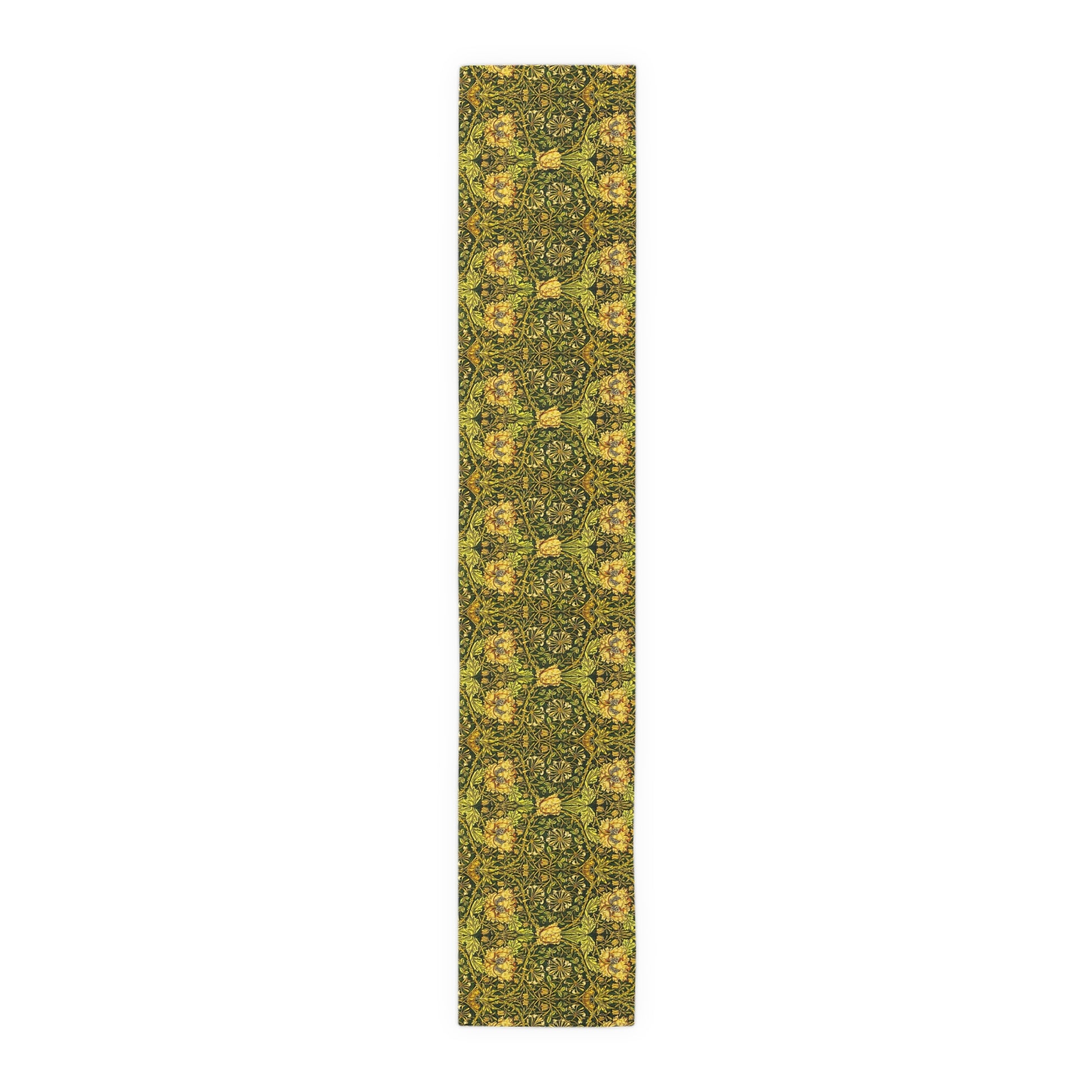 A floral patterned table runner in gold and green shades, laid out on a dining table with place settings and decorative flowers.