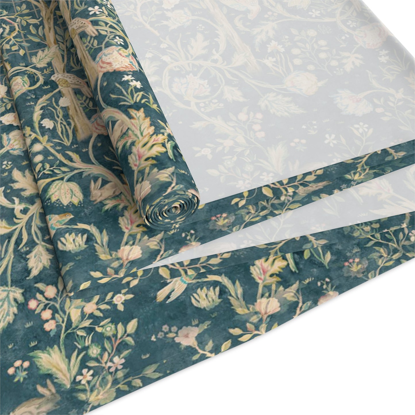 A table runner with a green and gold William Morris & Co pattern displayed on a dining table setting with dishes and glasses.