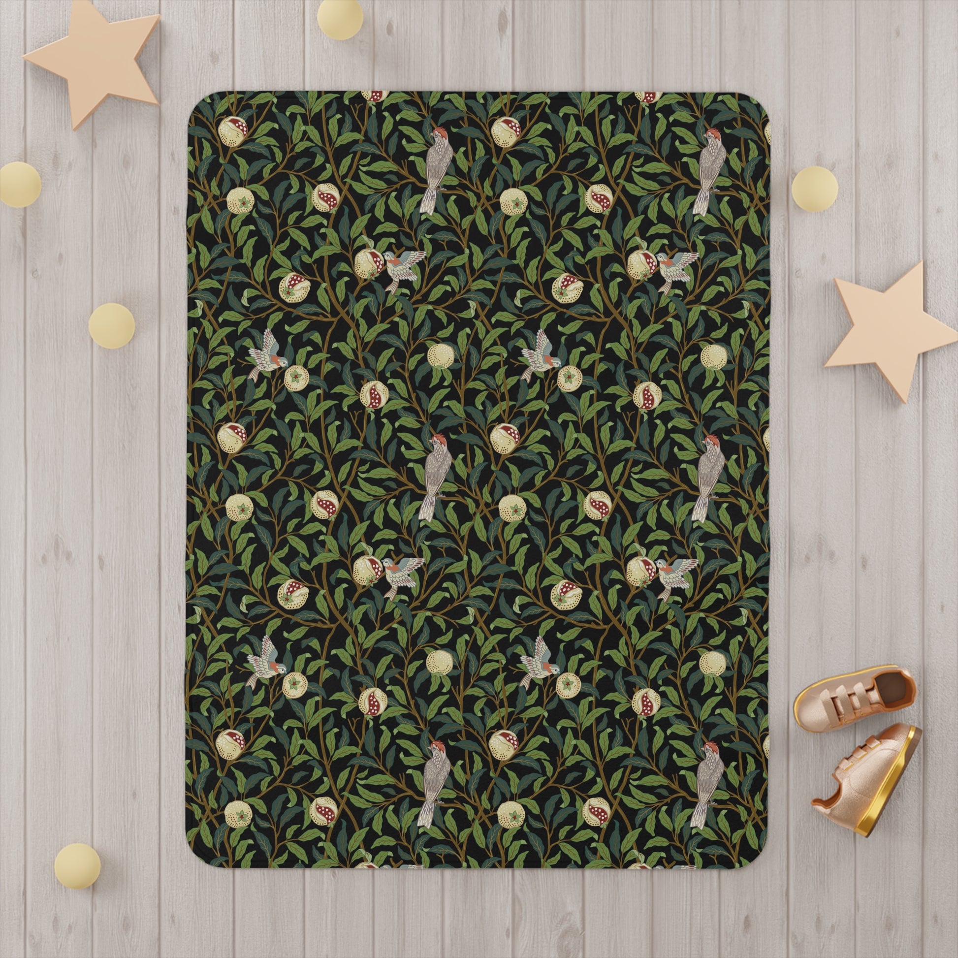 Patterned rug with birds and leaves on a wooden floor