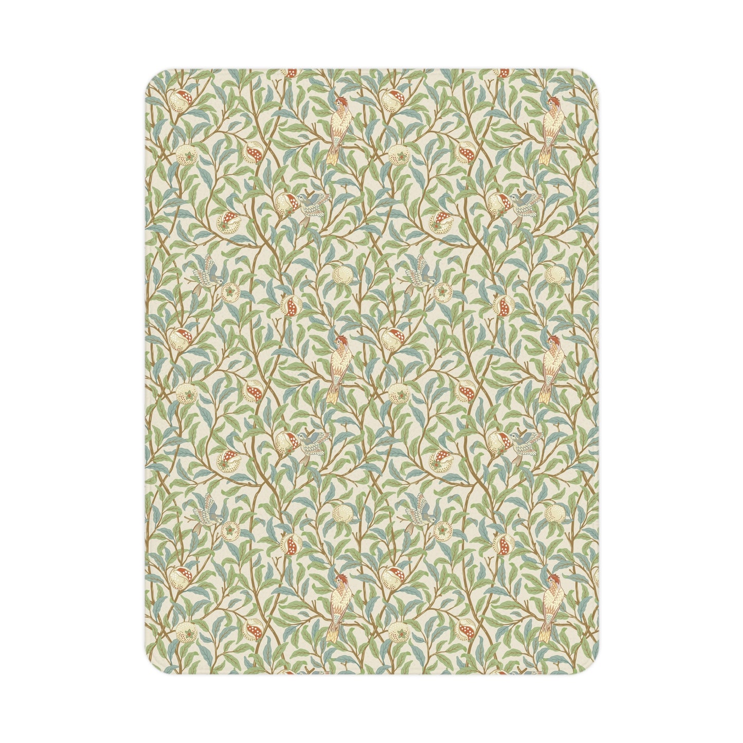 A toddler blanket with a floral pattern featuring birds and pomegranates in green, red, and beige colours on a parchment background.