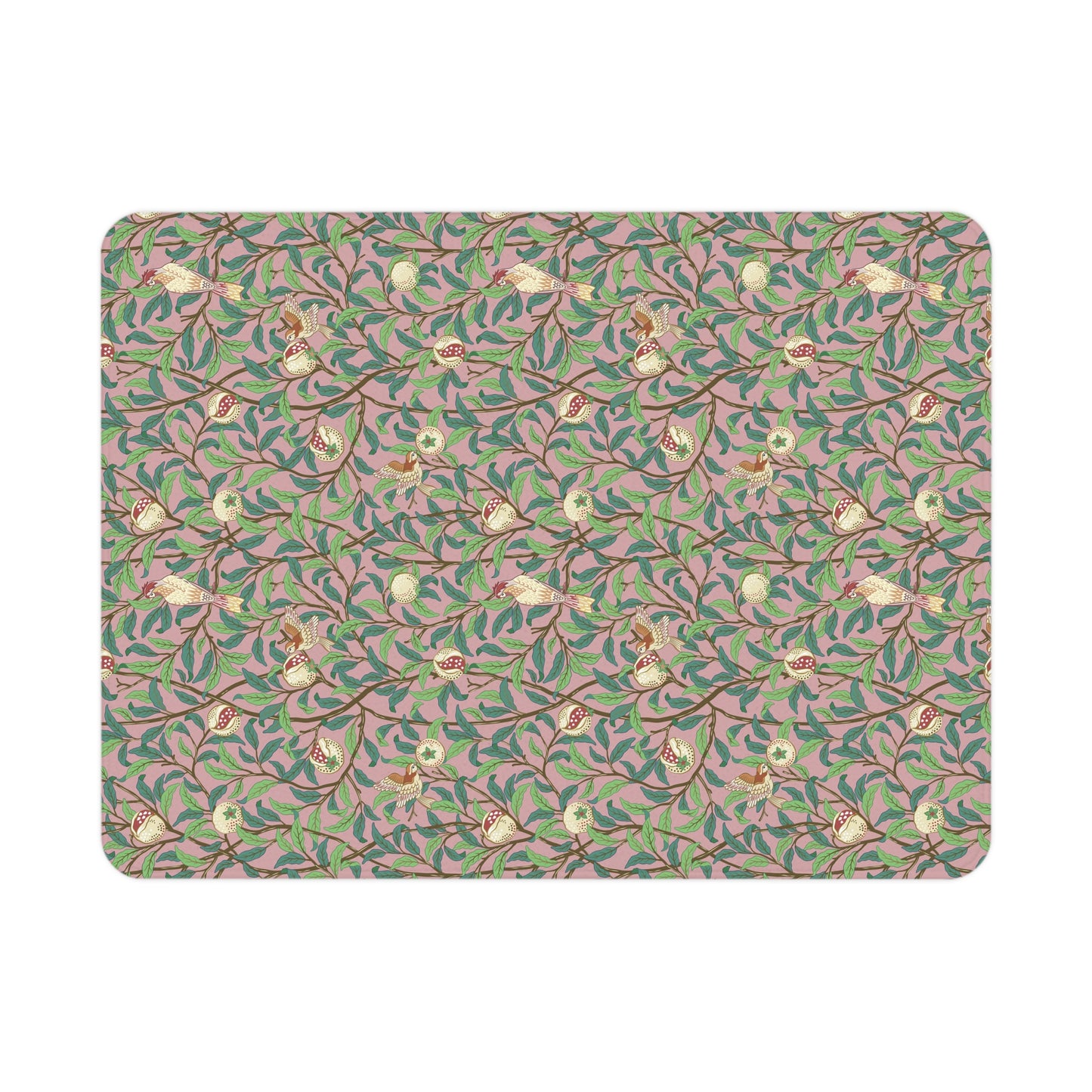 Patterned mat with floral and branch design on a pink background