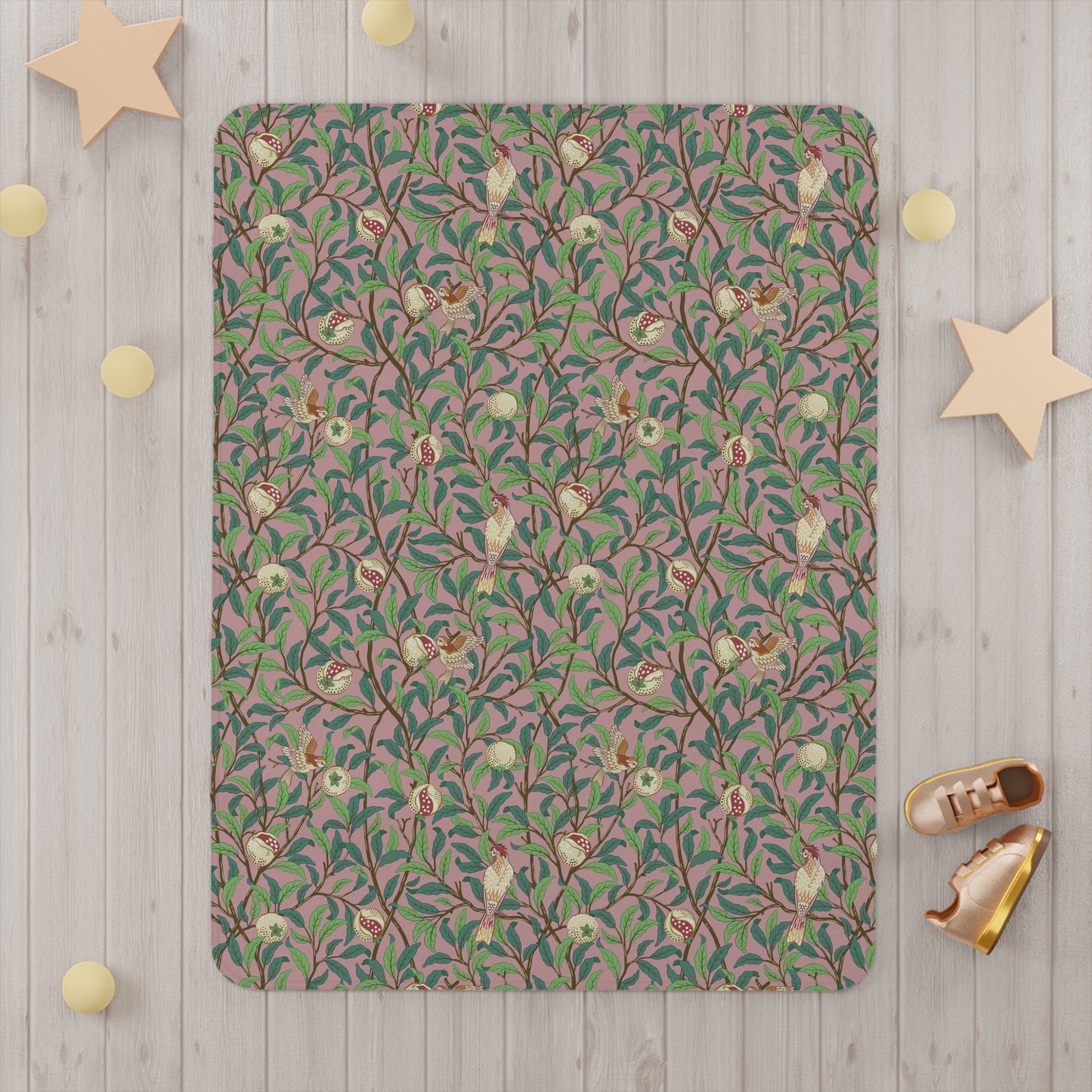 Patterned rug on a wooden floor with decorative stars and shoes around